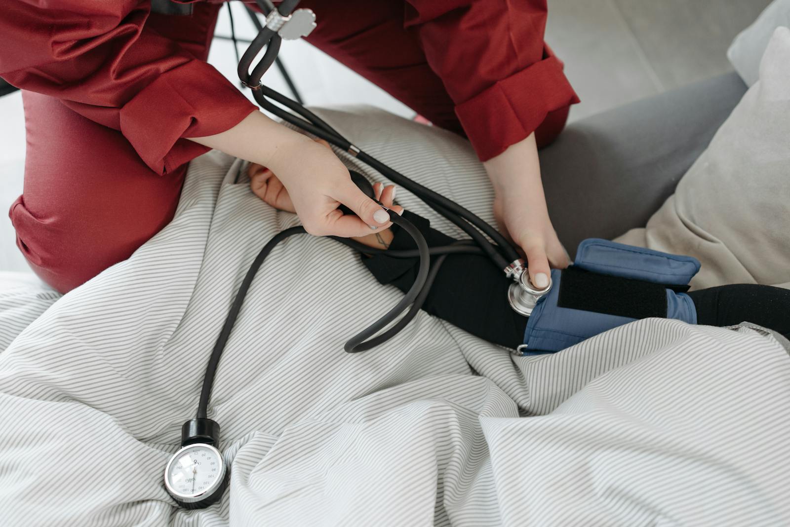 Clinician checking a patient's vitals during intake